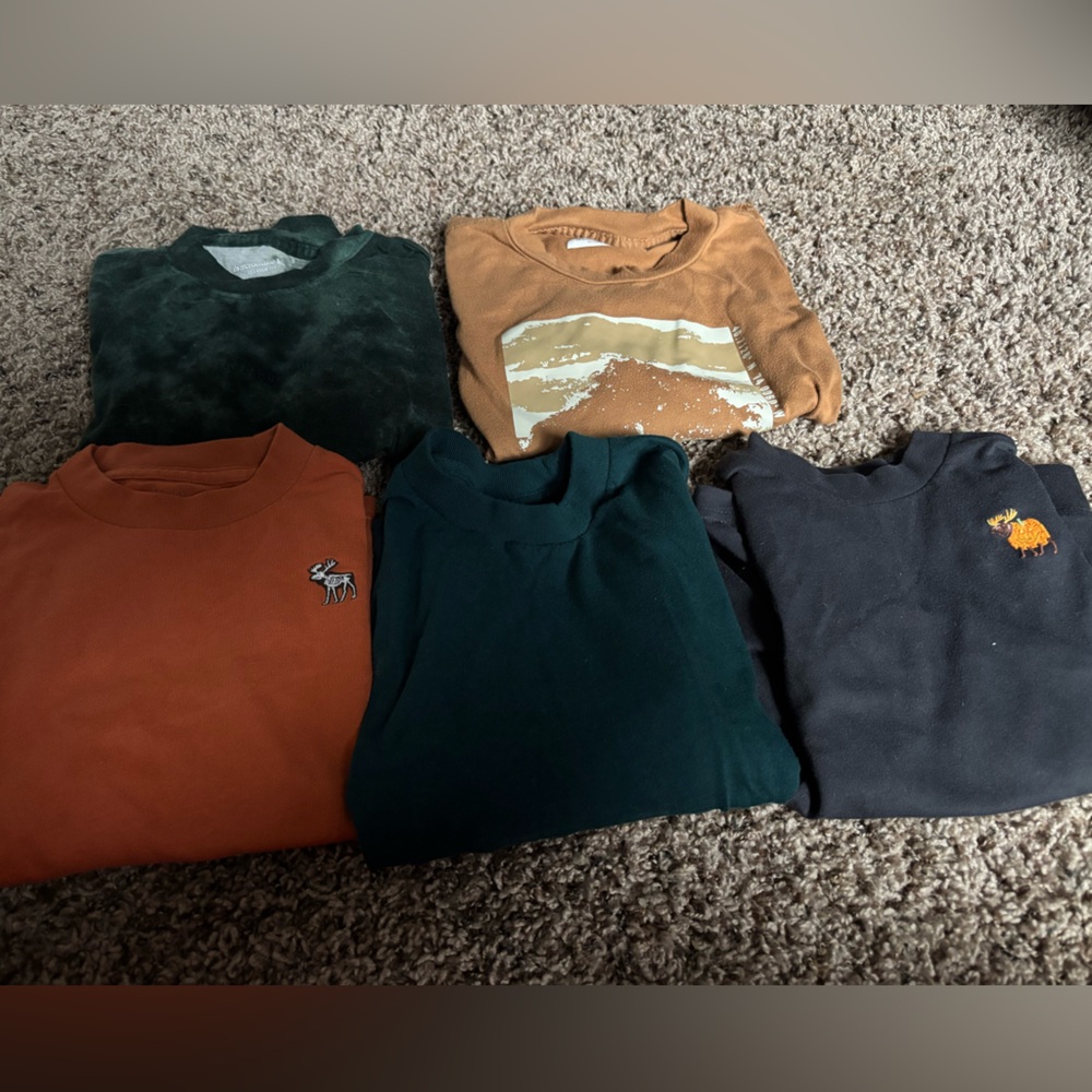 Assorted T-Shirts in Green, Orange, and Black
